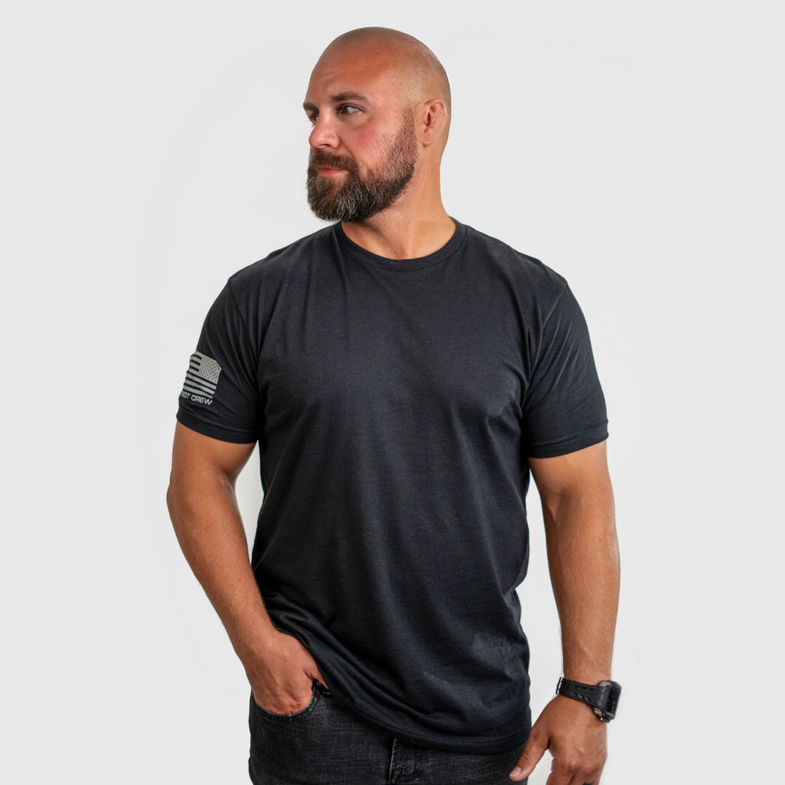 John M., 6 foot and 215 pounds, in a black Patriot Crew tee